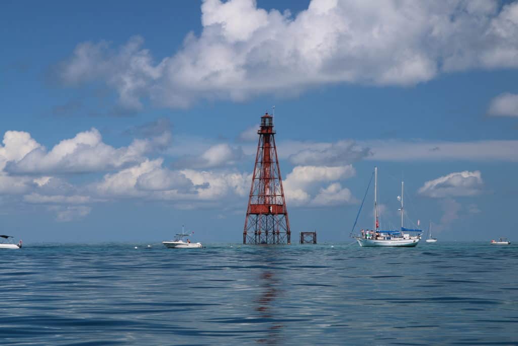 boats on calm water at lighthouse Florida Keys Sombrero