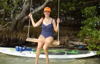 woman on a swing in the mangroves