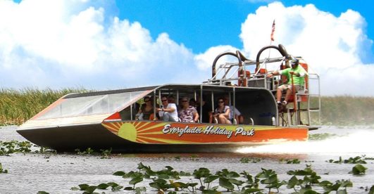 people enjoying airboat ride in Everglades