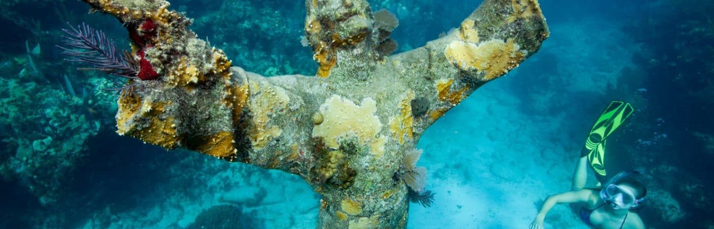 underwater statue with diver